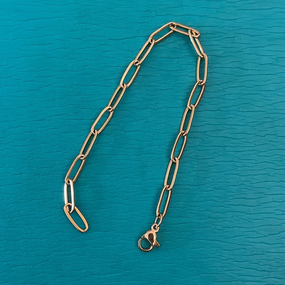 Gold plated paperclip chain bracket.